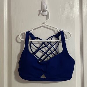 Lululemon sports bra in blue. Size 4. Front cut out. Cross cross back.